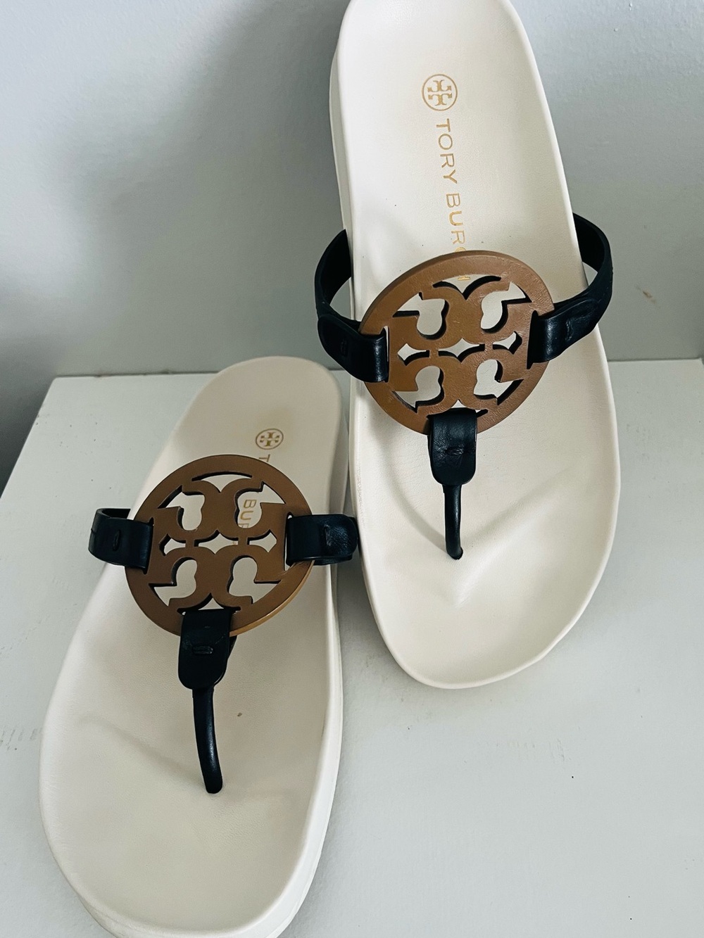 Tory Burch Black Strap Sandals with Brown Logo Medallion on White Footbed